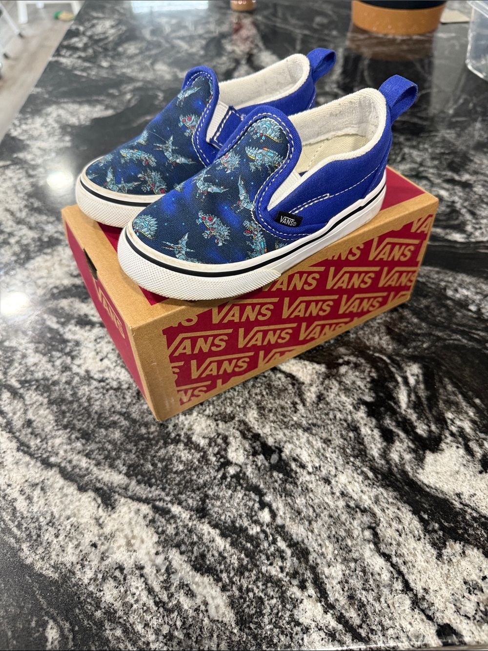 Vans Kids Slip-On Sneakers in Blue Dinosaur Pattern